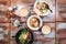 Flatlay of Chinese wanton dumpling noodle dishes