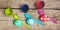 Flatlay, colorful easter eggs, egg dyes and spoons on wooden table
