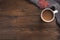 Flatlay composition with knitted scarf, cup of coffe on wooden desk table