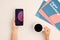 Flatlay of hands of contemporary businessperson having coffee and working