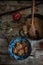 Flatlay of old fashioned apple crumble styled in beautiful bowl on an old wooden table.