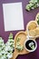 Flatlay Wooden heart shaped plate surrounded by white lilac flowers, cup of coffee and cookies - stylish rustic mockup card