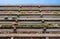 Flats built in post-war Brutalist style architecture at The Barbican in the City of London UK, with colourful flowers on the balco