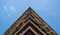 Flats built in post-war Brutalist style architecture at The Barbican in the City of London UK, with colourful flowers on the balco