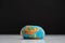 Flattened plasticine globe isolated on black, global warming concept