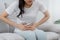 Flatulence asian young woman, girl hand in stomach ache, suffer from food poisoning, abdominal pain and colon problem, gastritis