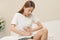 Flatulence ulcer, asian young woman, girl hands in belly, stomachache from food poisoning, abdominal pain and digestive problem,