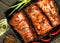 Flavored juicy pork ribs with red peppers, green onion and olive