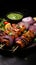 Flavorful charmers Indian chicken tikka kebabs, roasted, accompanied by chutney and onions