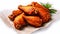 Flavorful delight, Succulent chicken wings seasoned to perfection on parchment