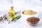 Flax seeds, flax flour, oil with sprouts and flax seed boxes on a light background