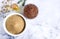 Flax seeds, flax flour, oil with sprouts and flax seed boxes on a light background