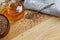 Flax seeds on spoon and in wooden bowl. Linseed oil in glass jug