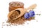 Flax seeds in the wooden scoop and bowl, beauty flowers