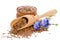 Flax seeds in the wooden scoop and bowl, beauty flowers