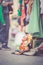 Flea market: shoes, dress and stuff in the foreground, people in the blurry background