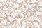 Flecked brown and white marble countertop seamless pattern with mottled texture
