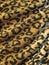 Fleecy brown draped leopard skin fabric