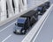 A fleet of black self-driving Fuel Cell Powered American Trucks driving on highway