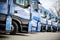 Fleet of commercial lorry trucks in row. Logistics and transportation service