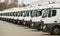 Fleet of commercial lorry trucks in row. Logistics and transportation service company