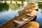 A fleet of rental rowboats bound to one another on a lake