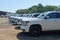 A fleet of White Chevy Tahoe equipped with Feniex Emergency Products