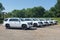 A fleet of White Chevy Tahoe equipped with Feniex Emergency Products