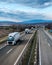 Fleet of White Trucks - a convoy in line at a rural countryside highway