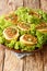 Fleischschnacka snails of meat, this French recipe from the Alsace serve with green salad close-up in a plate. Vertical