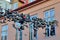 Flensburg, Germany - June 09, 2019: Shoes hanging between old houses in the german northernmost town called Flensburg