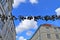 Flensburg, Germany - June 09, 2019: Shoes hanging between old houses in the german northernmost town called Flensburg