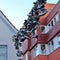 Flensburg, Germany - June 09, 2019: Shoes hanging between old houses in the german northernmost town called Flensburg