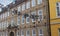 Flensburg, Germany - November 14, 2019: Shoes hanging between old houses in the german northernmost town called Flensburg