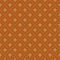 Fleur de lis french damask pattern in rust color. Ornamental fabric swatch close-up.