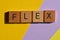 Flex, gen z, word in 3d wooden alphabet letters isoalted on purple and yellow