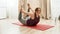 Flexibility in Every Move. Young curvy woman in sportswear exercising on a yoga mat at home