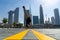 Flexible Acrobat keep balance on one hand with blurred Dubai cityscape. Concept of modern and healthy lifestyle