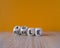 Flexible and agile symbol. Concept words Flexible and agile on wooden cubes. Beautiful wooden table, orange background. Business