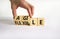 Flexible and agile symbol. Concept words Flexible and agile on wooden cubes. Businessman hand. Beautiful white table white