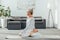 flexible athletic man practicing yoga on mat