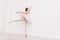 Flexible ballerina posing on tiptoes