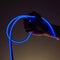 Flexible blue led tape neon in hand on black background