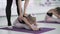 Flexible children ballet dancers doing stretching exercises on studio floor