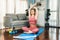 Flexible and dexterity woman in sportswear doing reverse gaiety yoga position