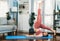 Flexible and dexterity woman in sportswear doing reverse gaiety yoga position