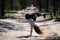 Flexible female gymnast makes exercise in the forest. Healthy lifestyle