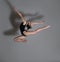 Flexible gymnast. Girl makes an expressive jump