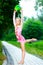 Flexible little girl doing gymnastics vertical