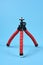 Flexible red tripod for smartphone